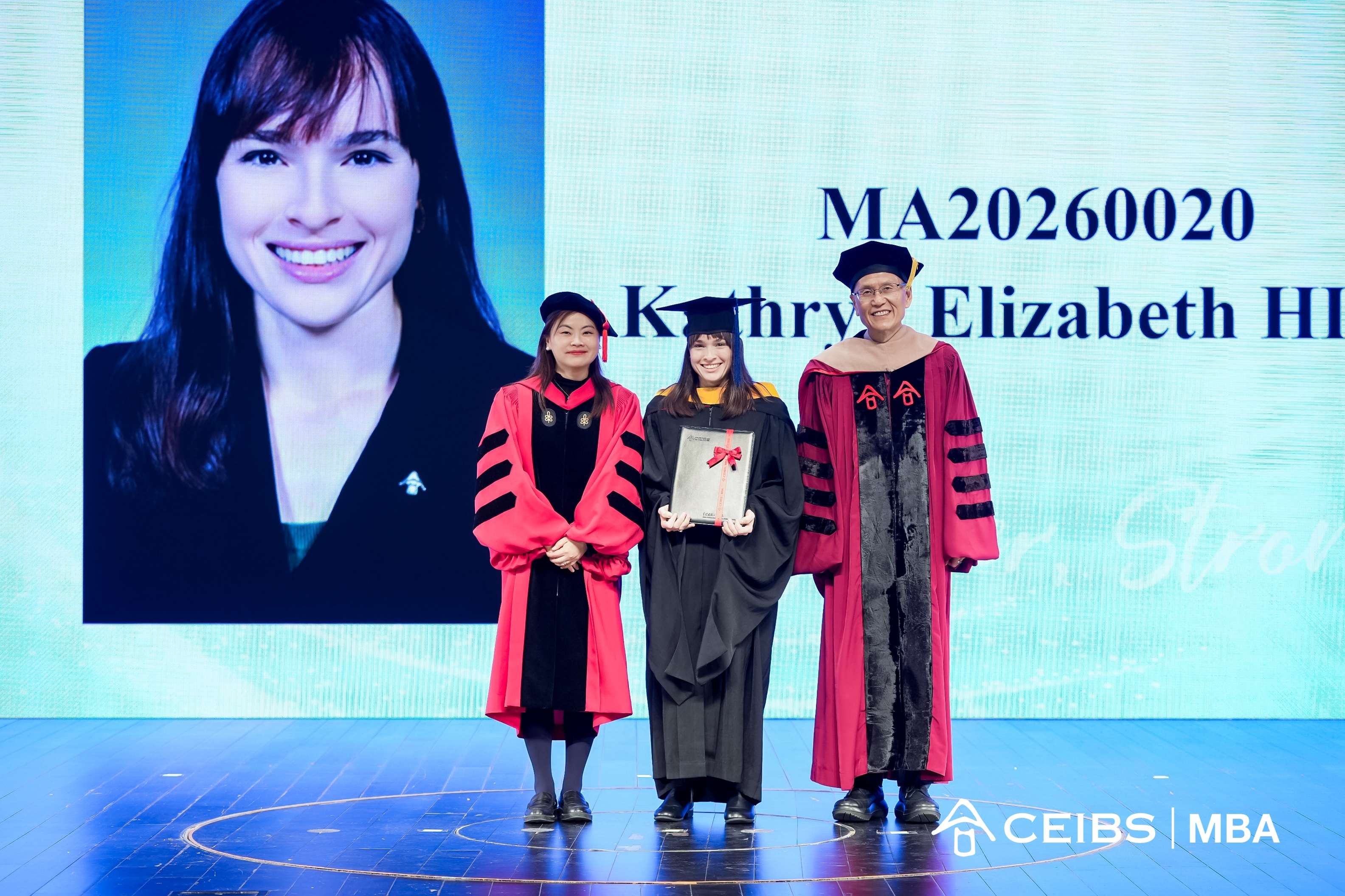 Professors present graduation certificates  to graduates