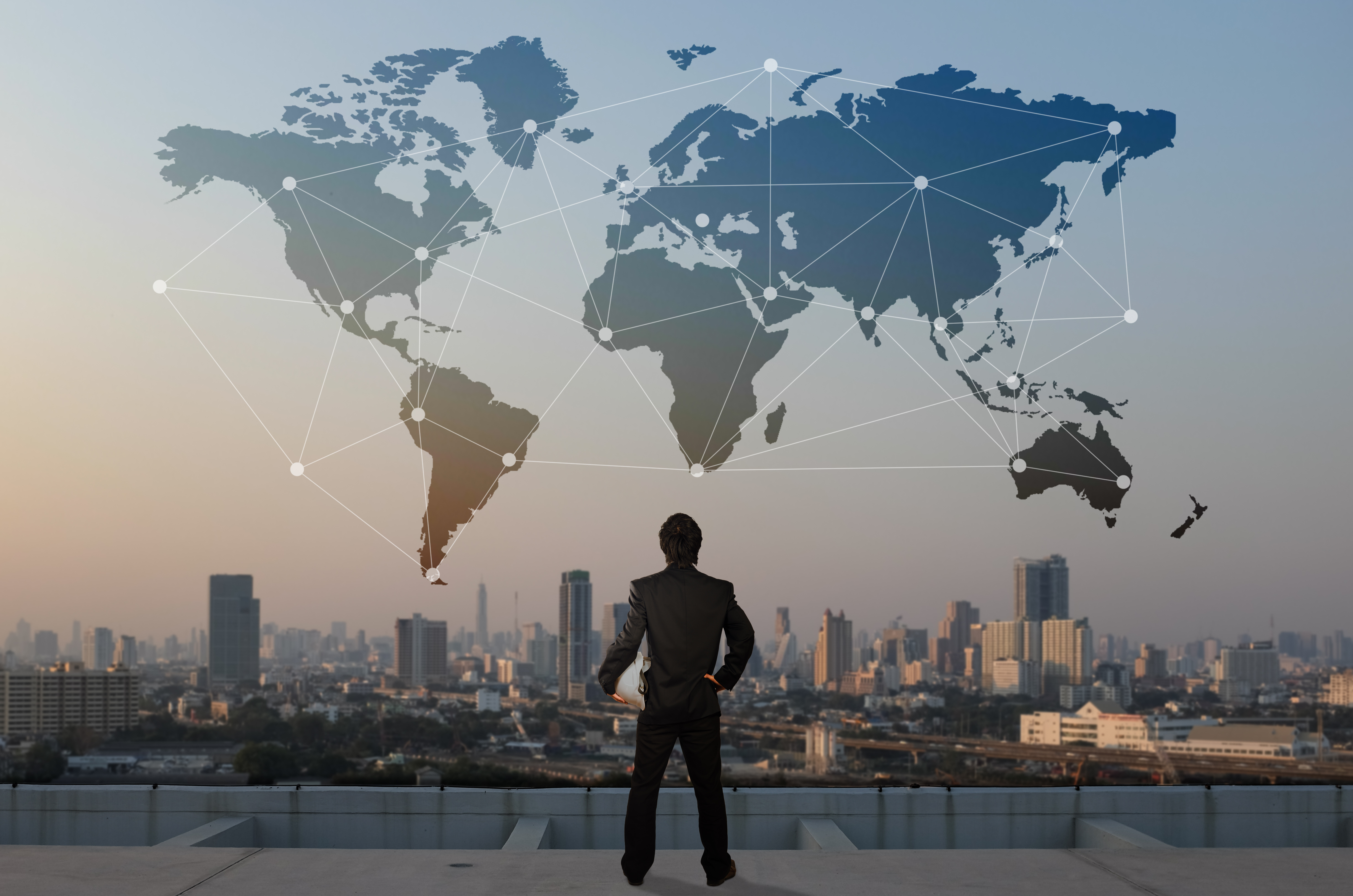 Man standing in front of world map